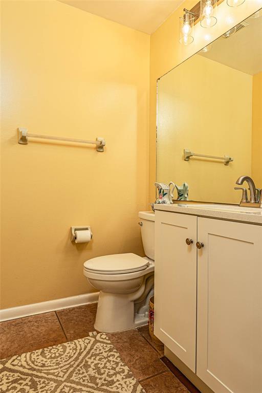 2903 Silver Ridge Drive Orlando, FL 32818 - Photo 20 of 27 a bathroom with a sink and a toilet