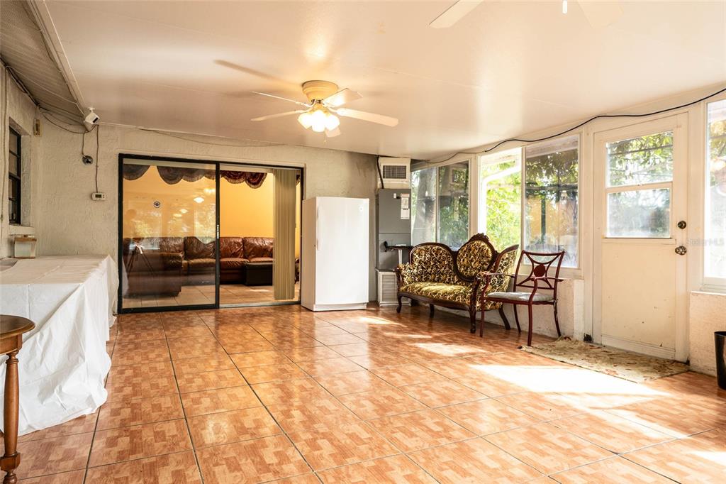 2903 Silver Ridge Drive Orlando, FL 32818 - Photo 22 of 27 a living room with furniture and a large window