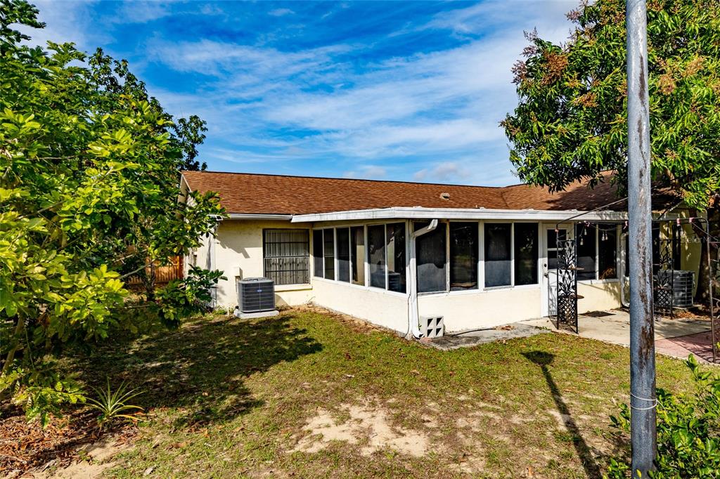 2903 Silver Ridge Drive Orlando, FL 32818 - Photo 23 of 27 a view of a house with a yard