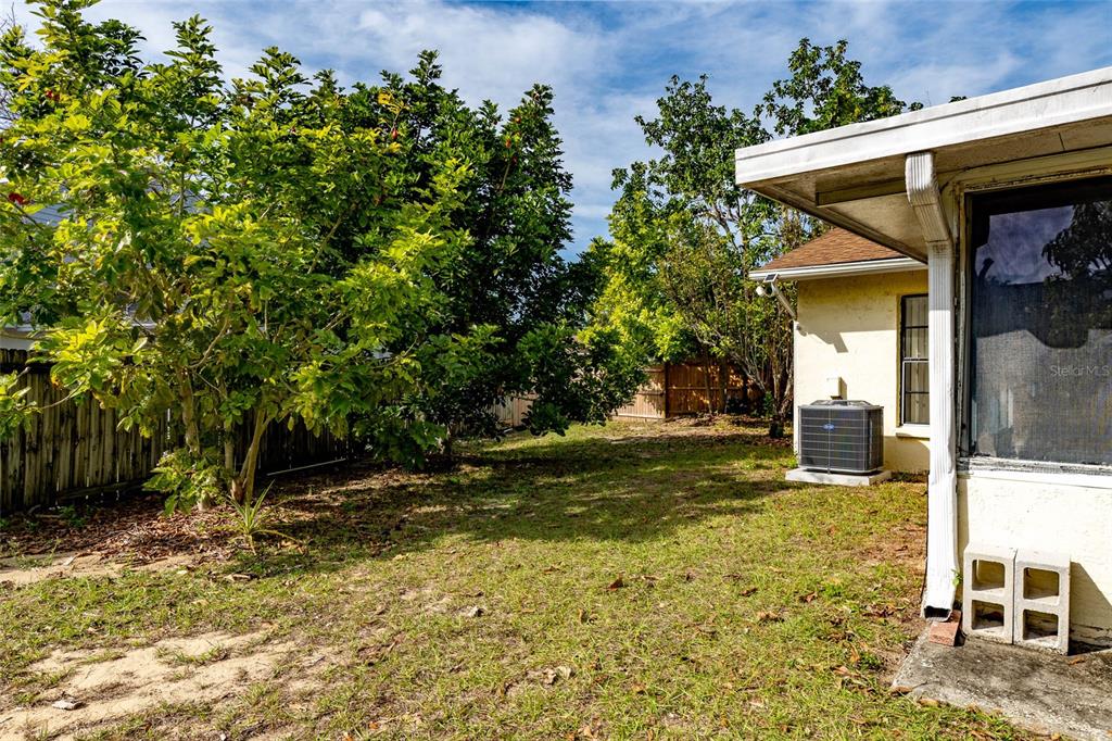 2903 Silver Ridge Drive Orlando, FL 32818 - Photo 24 of 27 a view of a house with backyard and sitting area