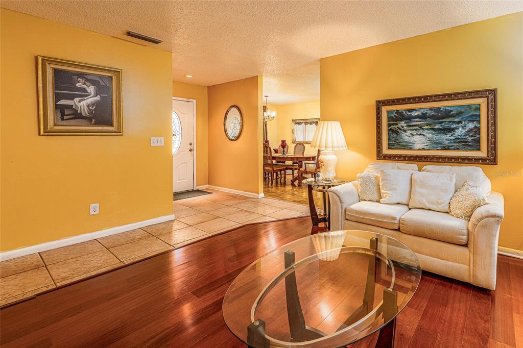 2903 Silver Ridge Drive Orlando, FL 32818 - Photo 5 of 27 a living room with furniture and wooden floor