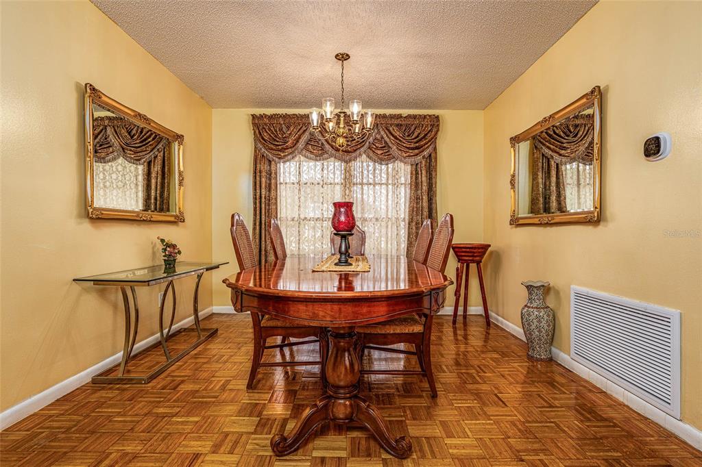 2903 Silver Ridge Drive Orlando, FL 32818 - Photo 10 of 27 a view of a dining room with furniture window and outside view