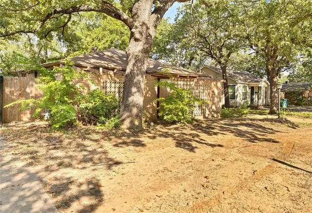 a view of road with large trees