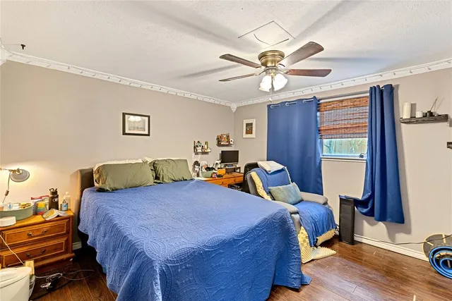 a bedroom with two beds and a chandelier