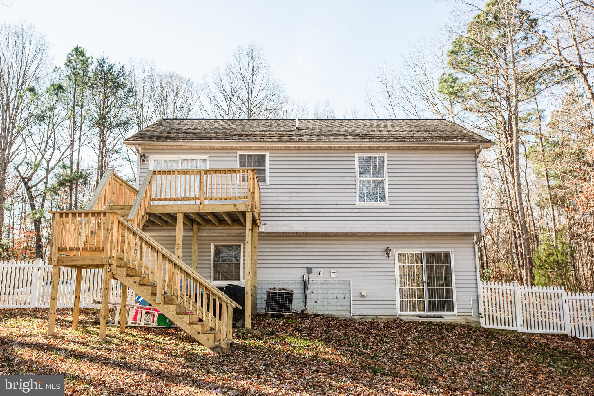 12 Johnson Drive Ruther Glen, VA 22546 - Photo 25 of 33 Large deck has stairs to back yard.