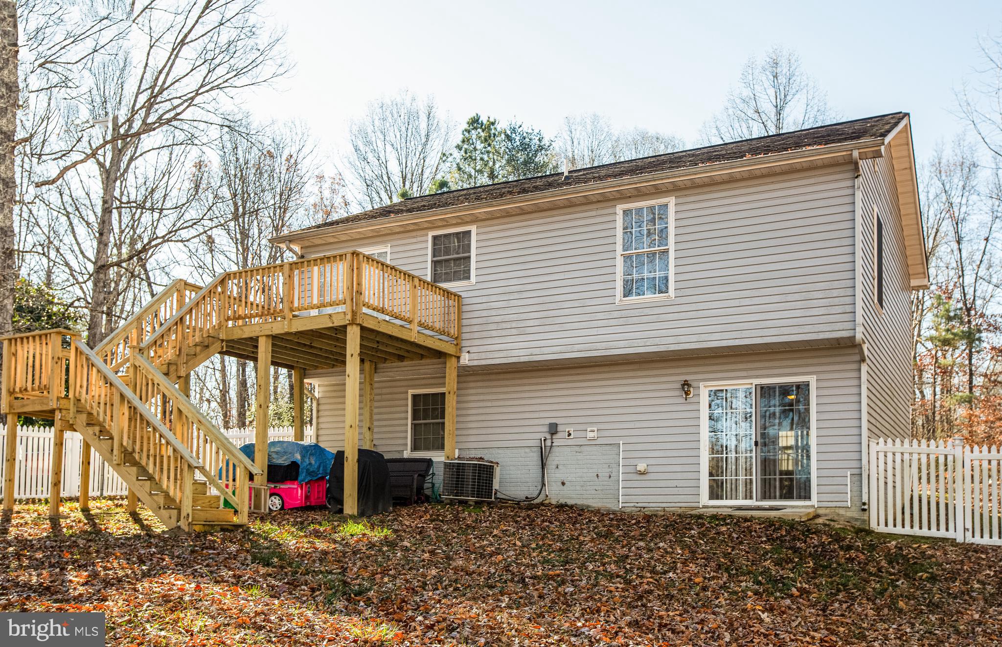 12 Johnson Drive Ruther Glen, VA 22546 - Photo 26 of 33 Large deck has stairs to back yard.