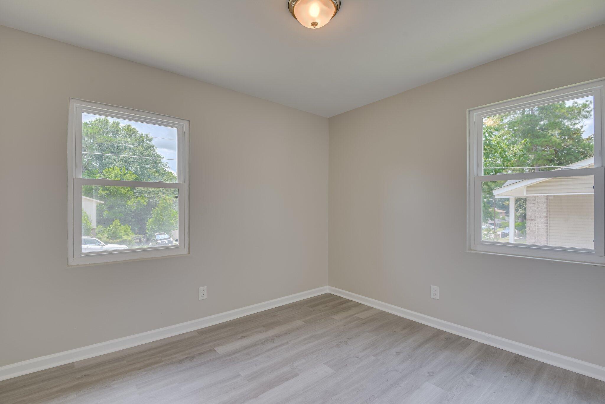 2115 Ashley Drive Augusta, GA 30906 - Photo 27 of 38 an empty room with wooden floor and windows