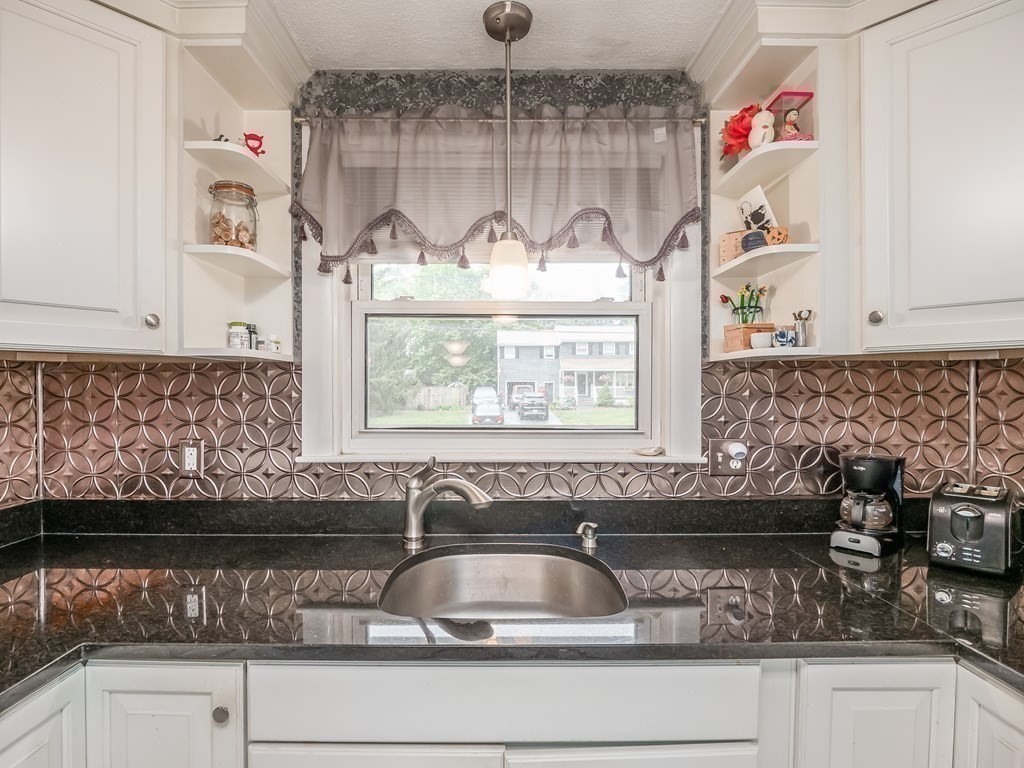 15 A Sylvan Road, Unit 2 Billerica, MA 01821 - Photo 10 of 28 a kitchen with a sink and a window