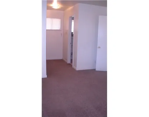 a view of a room with a large window