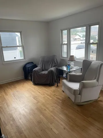 a living room with furniture and windows