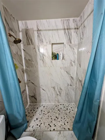 a bed room with a bed and a window