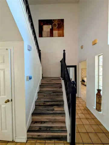 a bathroom with a sink vanity mirror and toilet