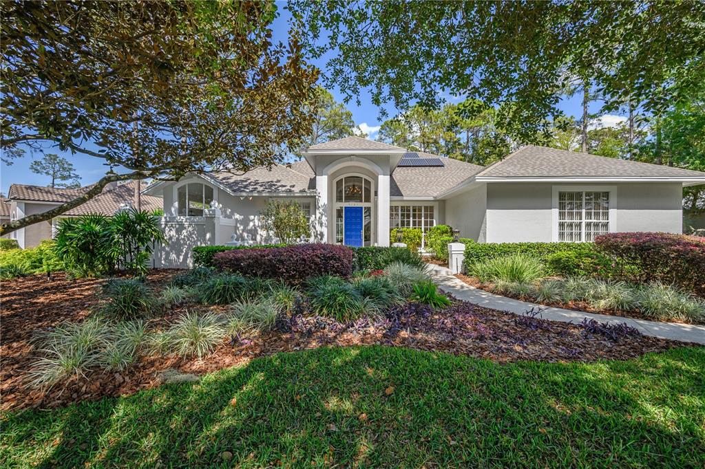5121 Timberview Terrace Orlando, FL 32819 - Photo 1 of 1 a front view of a house with a garden