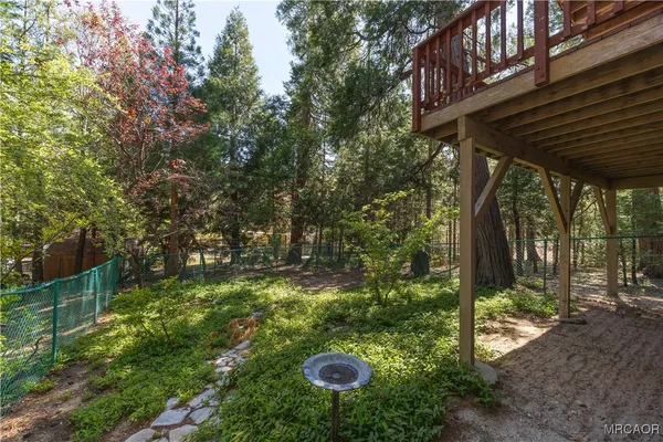 a view of backyard with green space