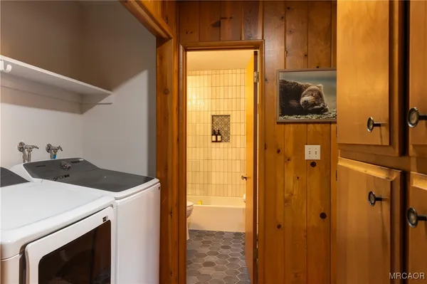 a utility room with dryer and washer