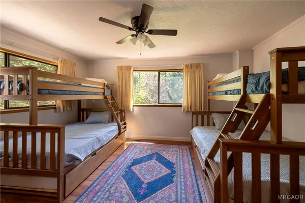 a bedroom with furniture and a window