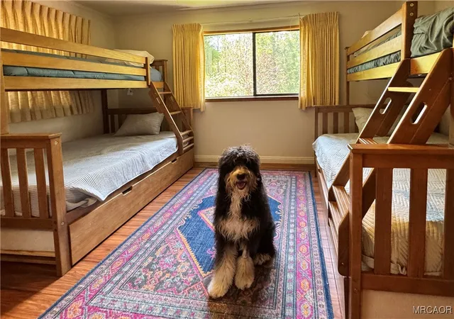 a bedroom with furniture and a window