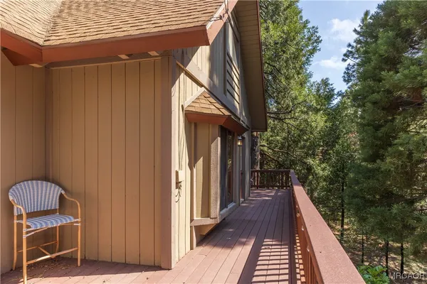 a view of balcony and wooden floor