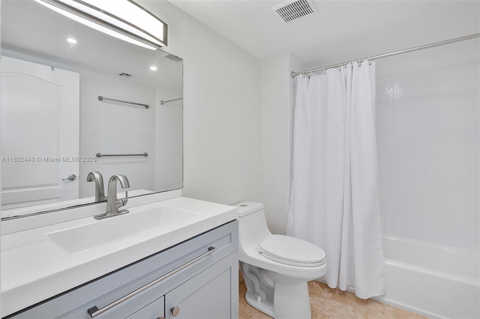 280 Southwest 20th Road, Unit 407 Miami, FL 33129 - Photo 11 of 23 a bathroom with a sink toilet and shower