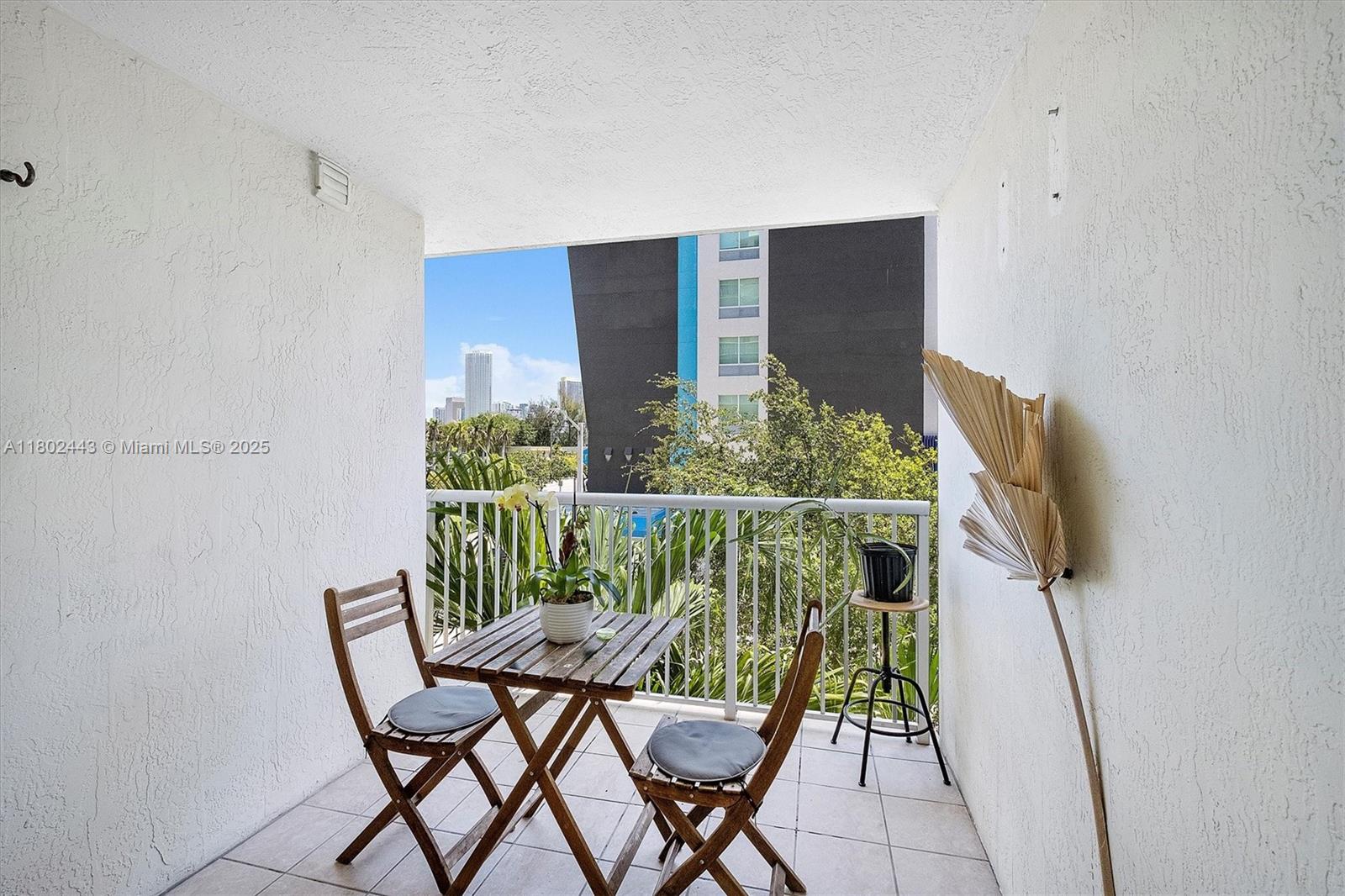 280 Southwest 20th Road, Unit 407 Miami, FL 33129 - Photo 12 of 23 a balcony view with two chairs and a table