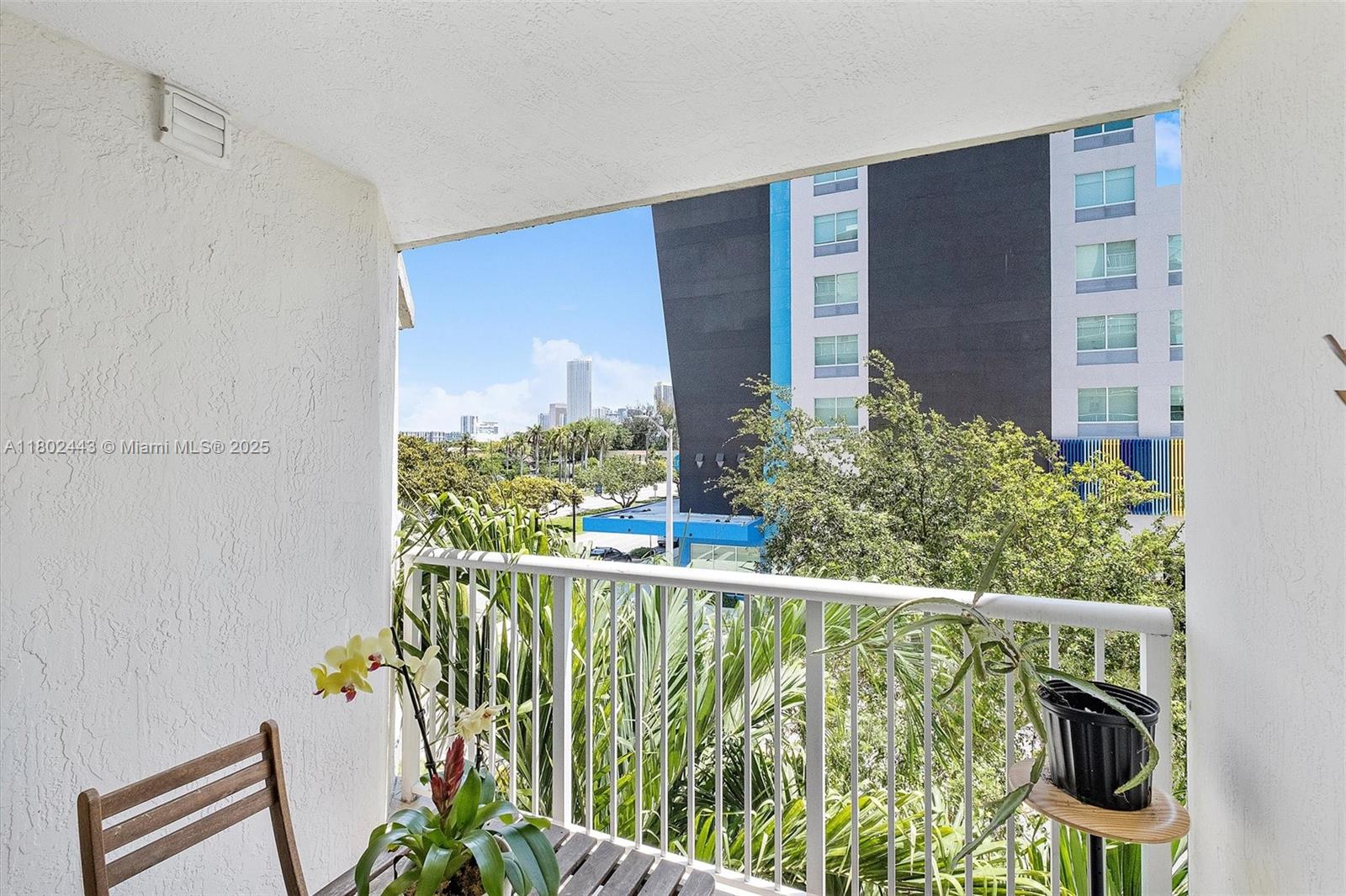 280 Southwest 20th Road, Unit 407 Miami, FL 33129 - Photo 13 of 23 a view of a balcony with chairs
