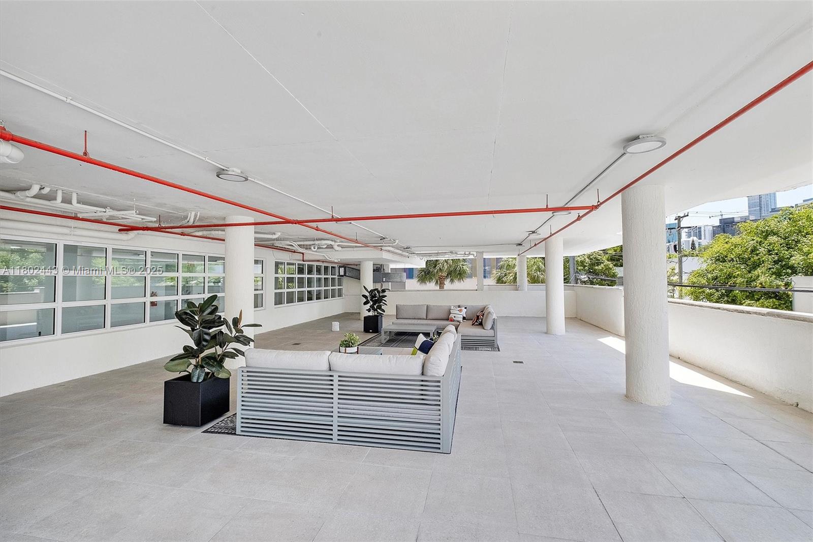 280 Southwest 20th Road, Unit 407 Miami, FL 33129 - Photo 15 of 23 a lobby with furniture and flowers