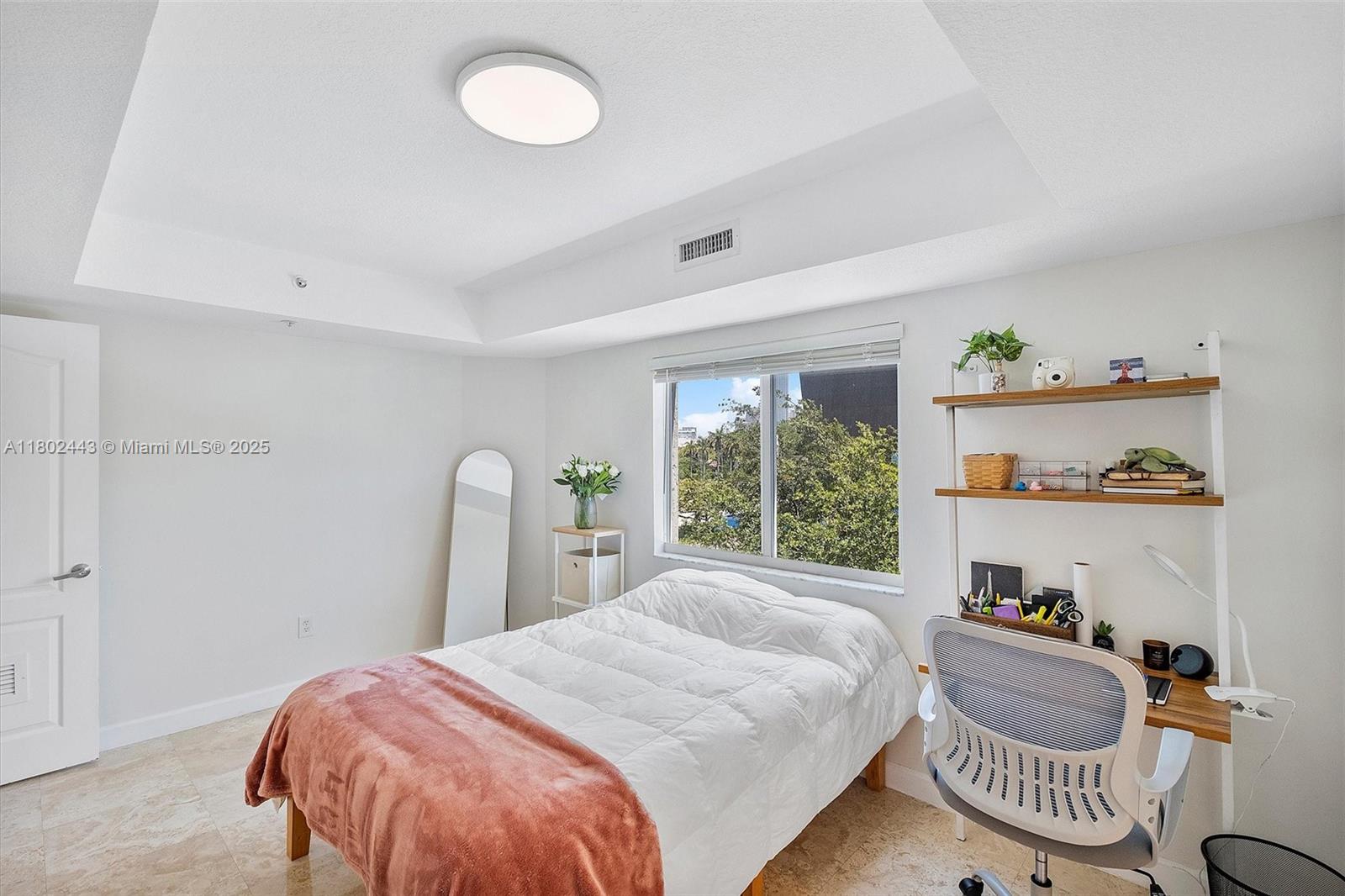 280 Southwest 20th Road, Unit 407 Miami, FL 33129 - Photo 10 of 23 a bedroom with a bed and a window