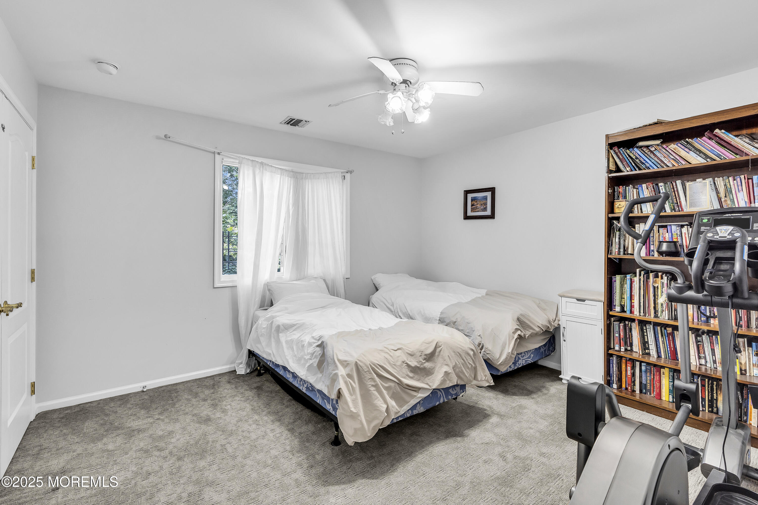 100 Case Road Lakewood, NJ 08701 - Photo 22 of 36 a bedroom with a bed furniture and a book shelf