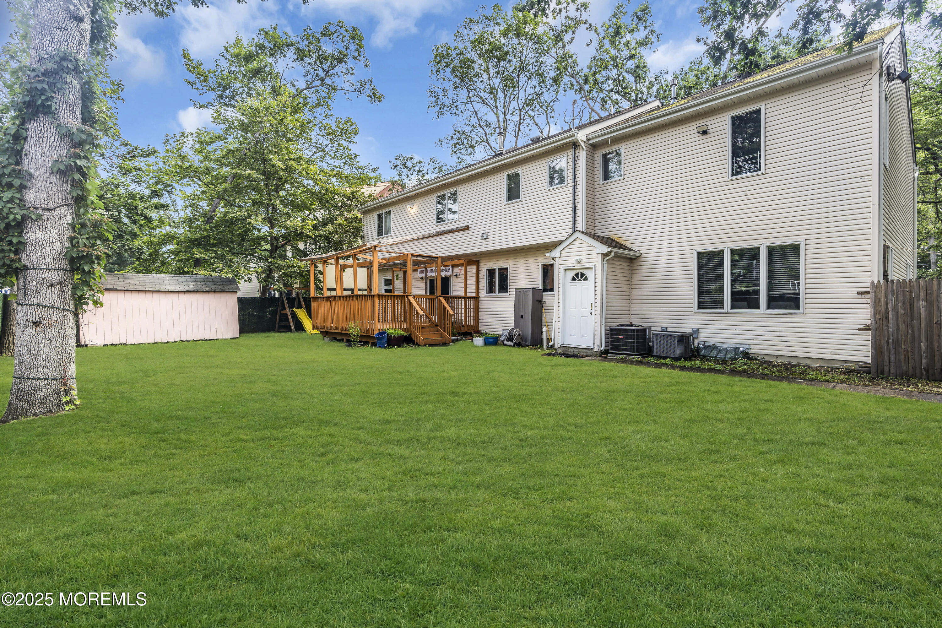 100 Case Road Lakewood, NJ 08701 - Photo 35 of 36 a front view of a house with a garden