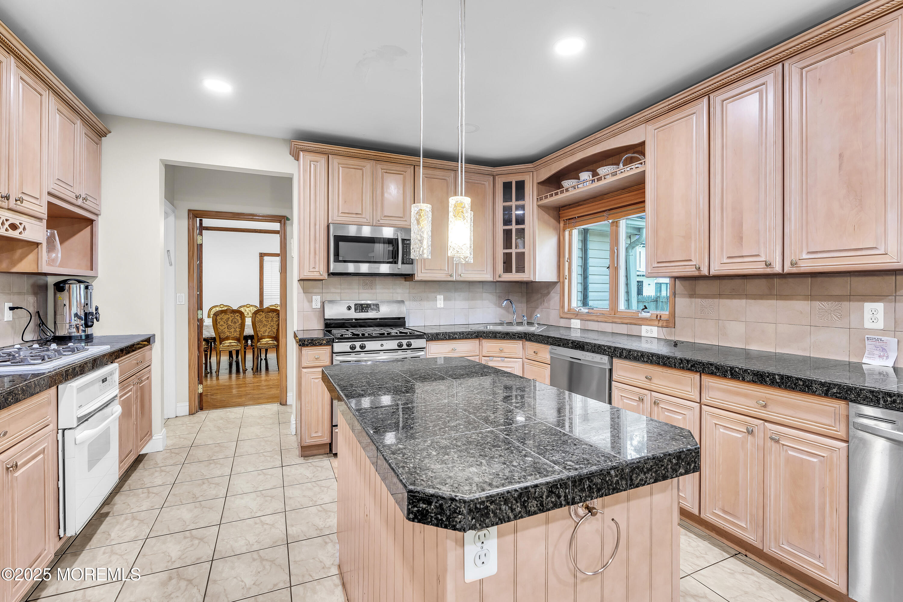 100 Case Road Lakewood, NJ 08701 - Photo 8 of 36 a kitchen with stainless steel appliances granite countertop a sink stove and cabinets