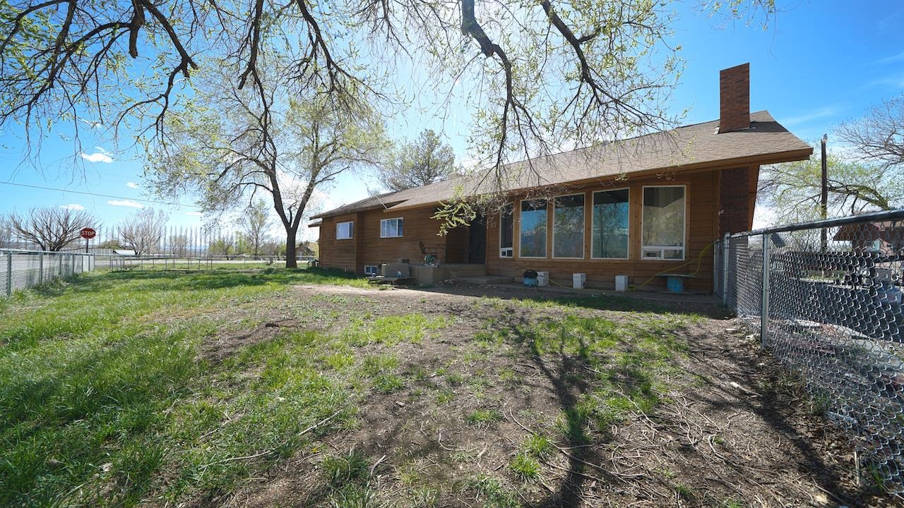3458 G Road Clifton, CO 81520 - Photo 3 of 30 a front view of a house with garden
