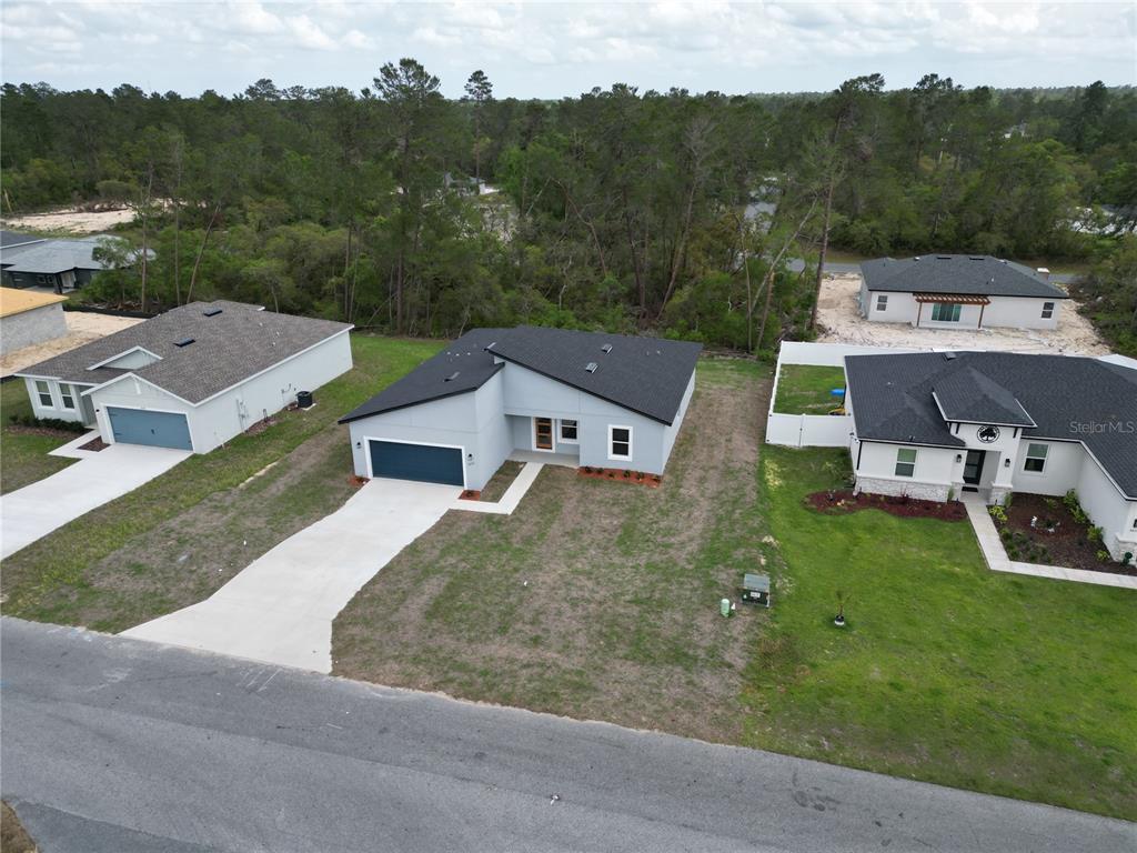 2644 Southwest 162nd Street Road Ocala, FL 34473 - Photo 2 of 47 an aerial view of a house with a garden