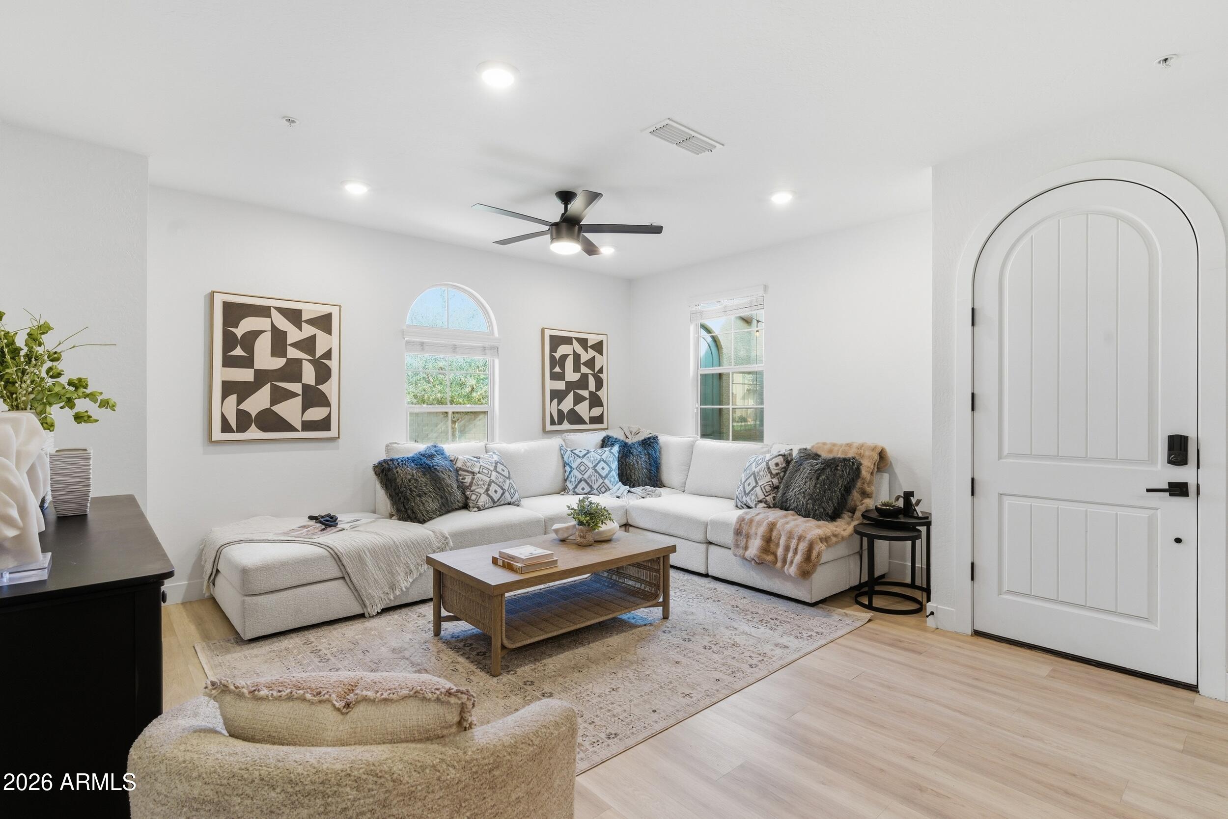 3855 South McQueen Road, Unit 34 Chandler, AZ 85286 - Photo 13 of 48 a living room with furniture and wooden floor