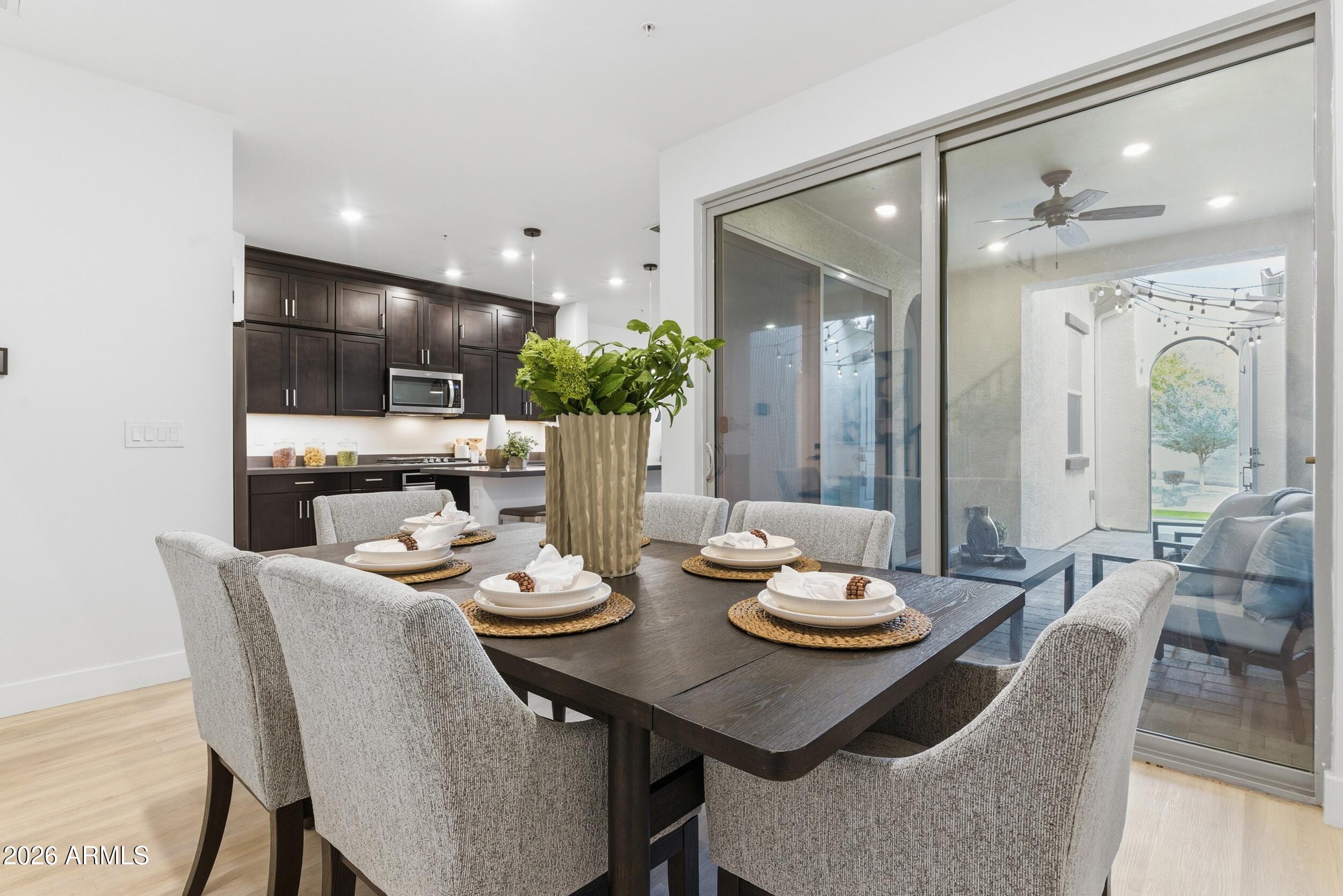 3855 South McQueen Road, Unit 34 Chandler, AZ 85286 - Photo 15 of 48 a view of a dining room with furniture and a potted plant