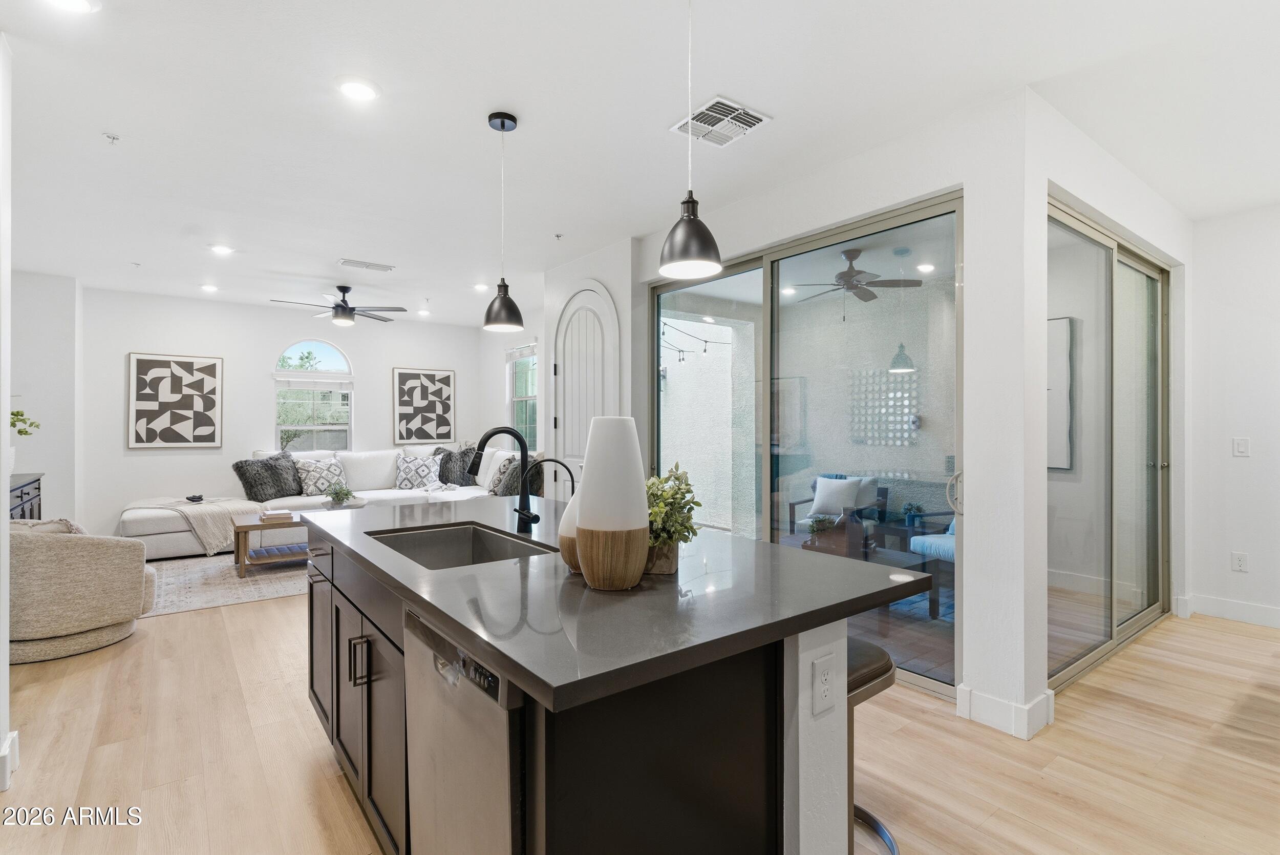 3855 South McQueen Road, Unit 34 Chandler, AZ 85286 - Photo 22 of 48 a kitchen with a sink and refrigerator