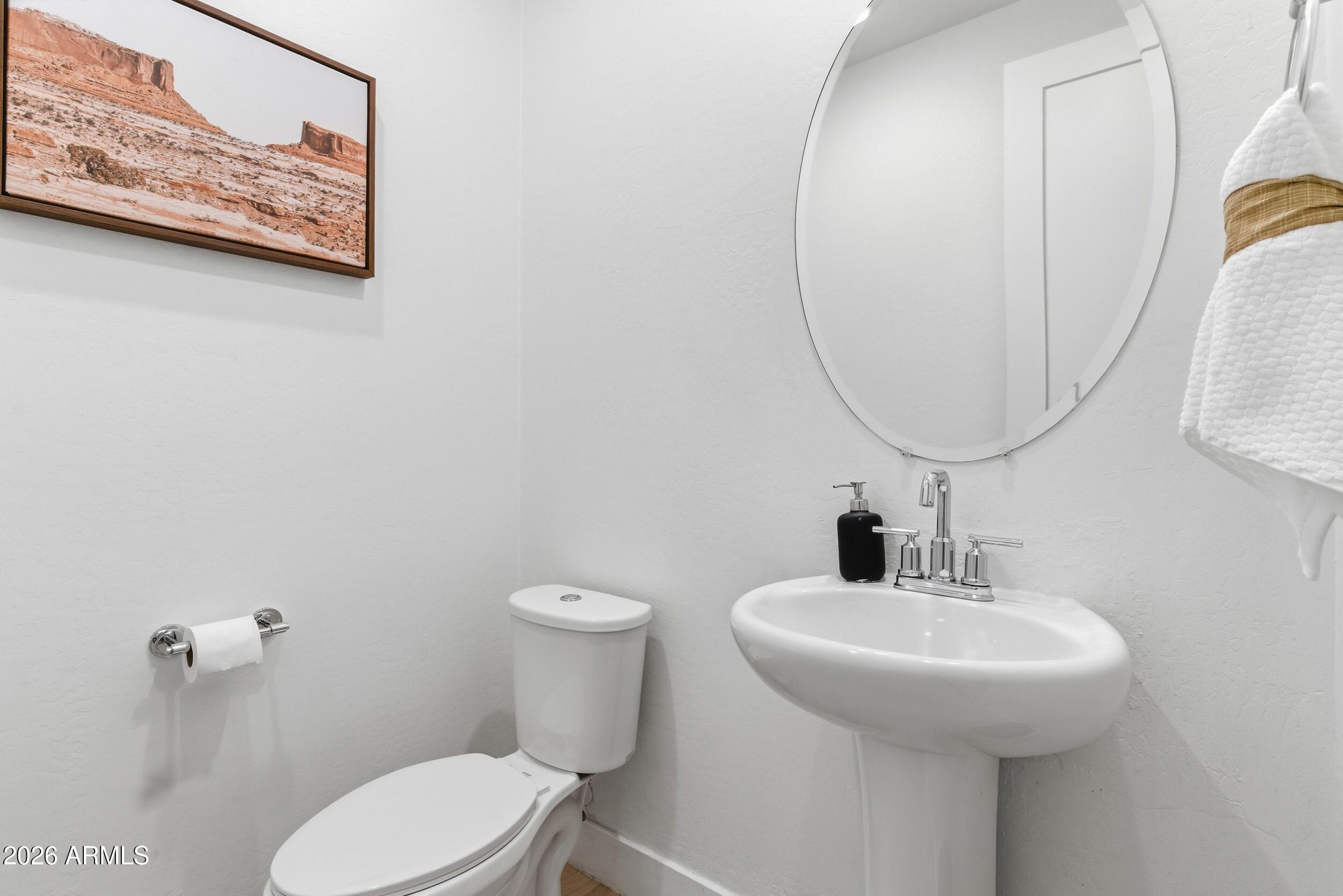 3855 South McQueen Road, Unit 34 Chandler, AZ 85286 - Photo 24 of 48 a bathroom with a toilet and a sink