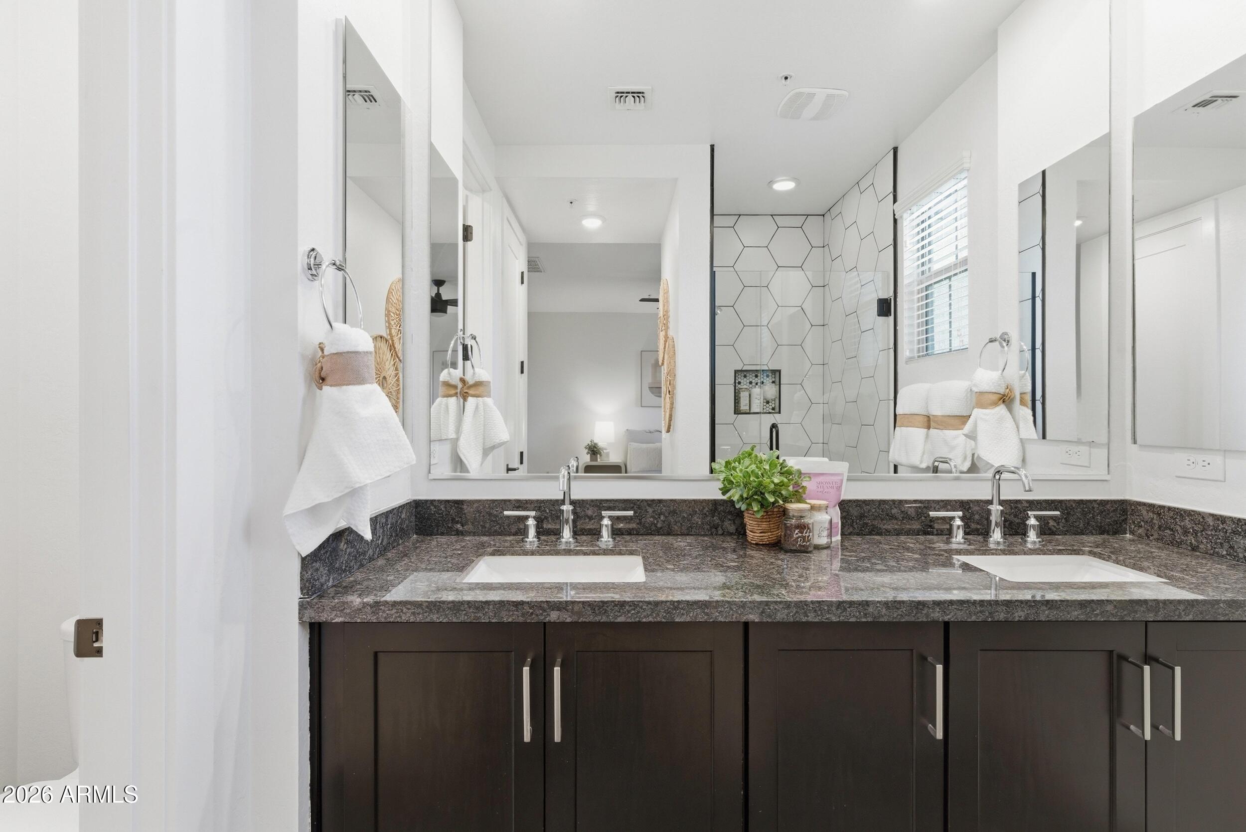 3855 South McQueen Road, Unit 34 Chandler, AZ 85286 - Photo 29 of 48 a bathroom with double sink and a mirror