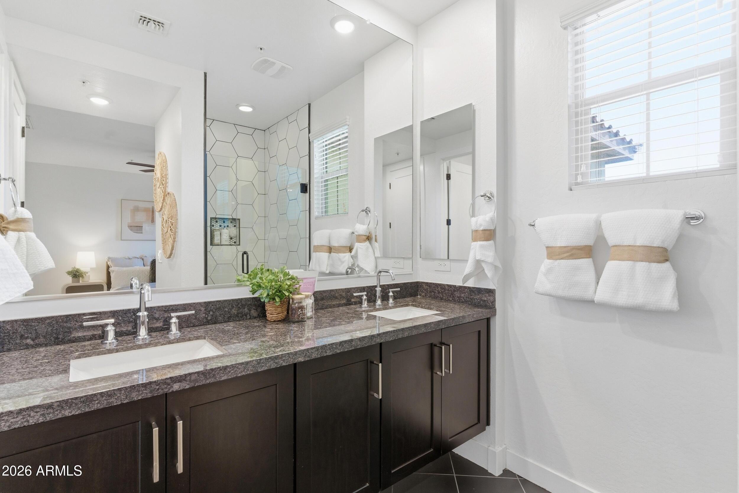 3855 South McQueen Road, Unit 34 Chandler, AZ 85286 - Photo 34 of 48 a bathroom with double vanity sinks and a mirror