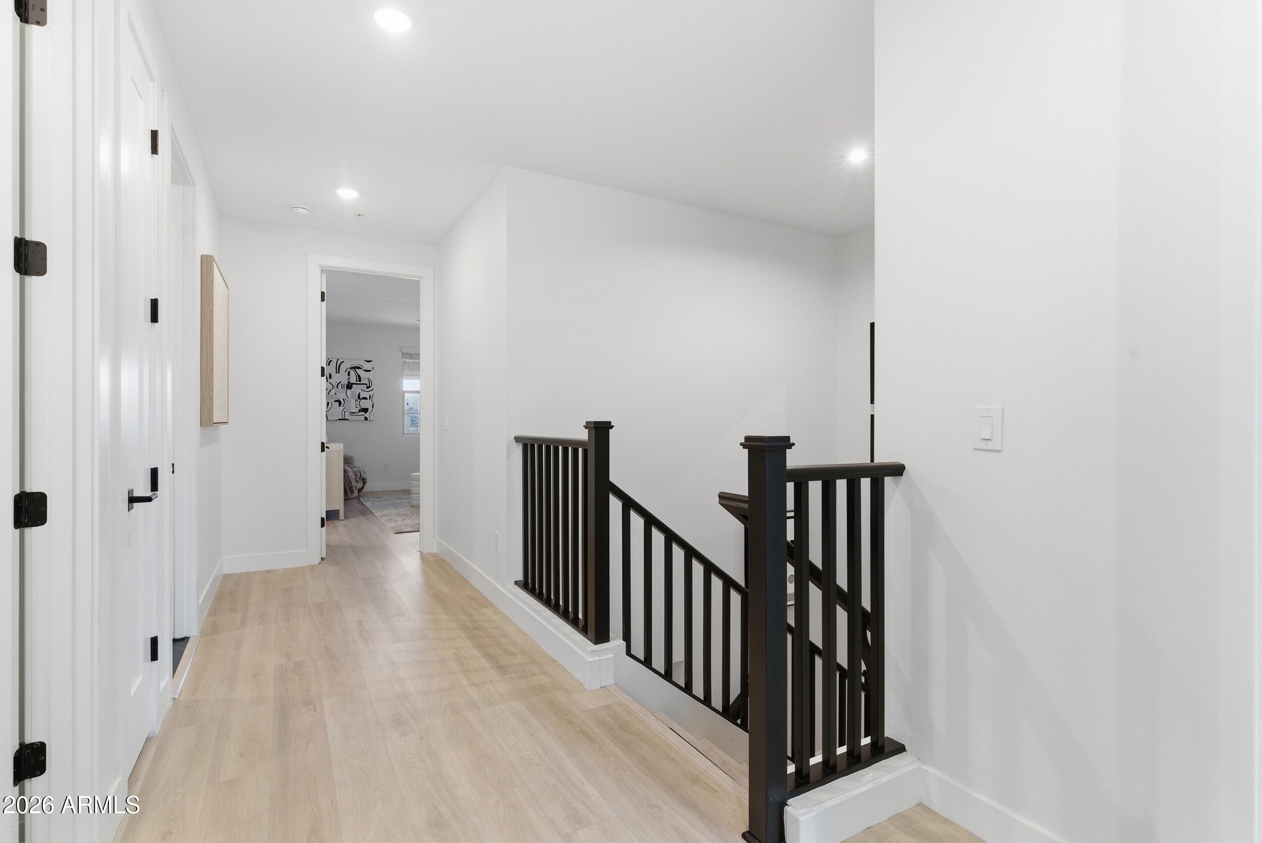 3855 South McQueen Road, Unit 34 Chandler, AZ 85286 - Photo 36 of 48 a view of a hallway with wooden floor and staircase