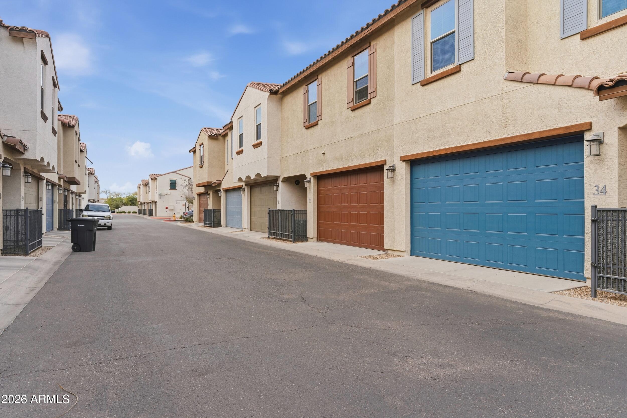 3855 South McQueen Road, Unit 34 Chandler, AZ 85286 - Photo 6 of 48 a view of a street with buildings