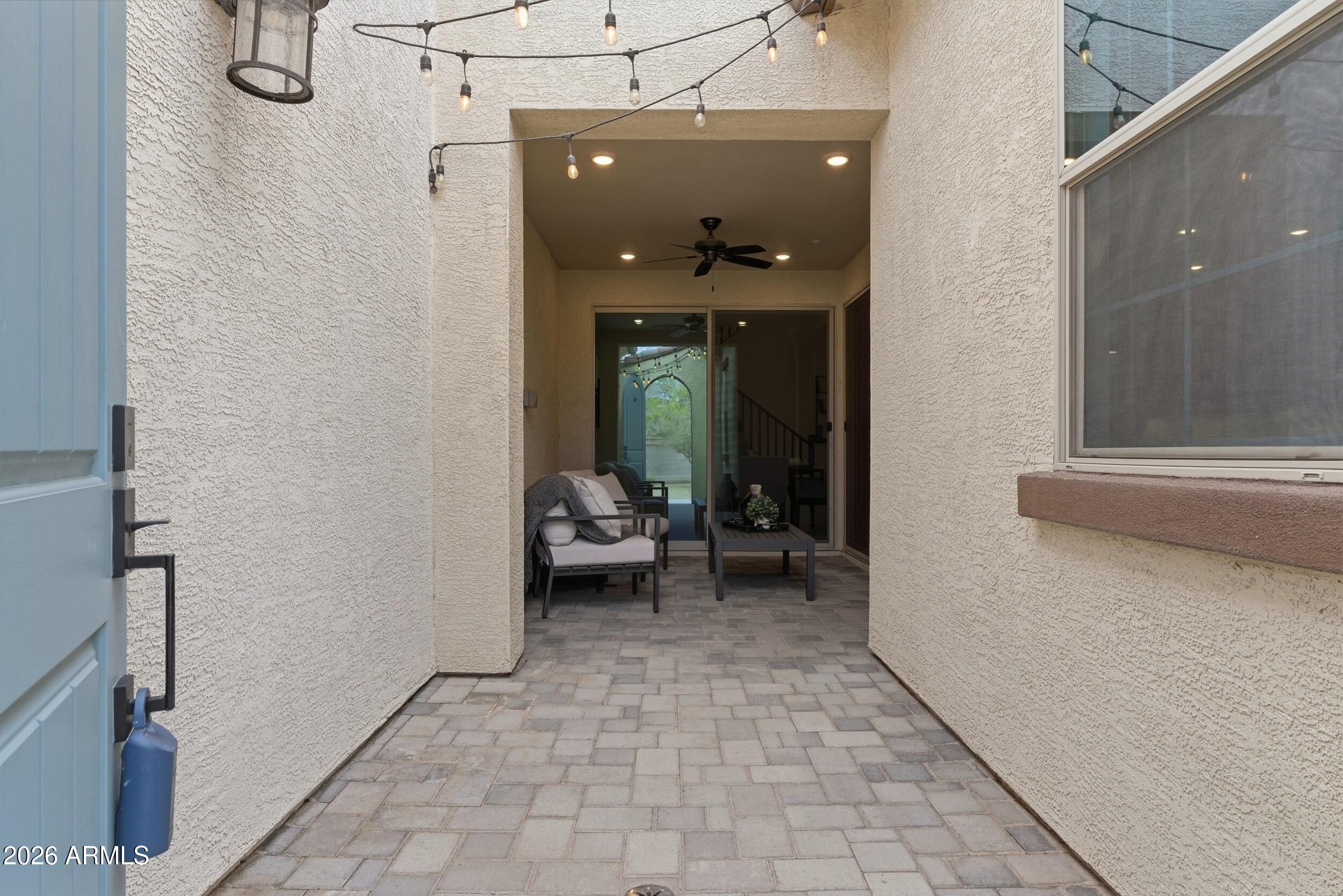 3855 South McQueen Road, Unit 34 Chandler, AZ 85286 - Photo 7 of 48 a view of a hallway with living room and a couch