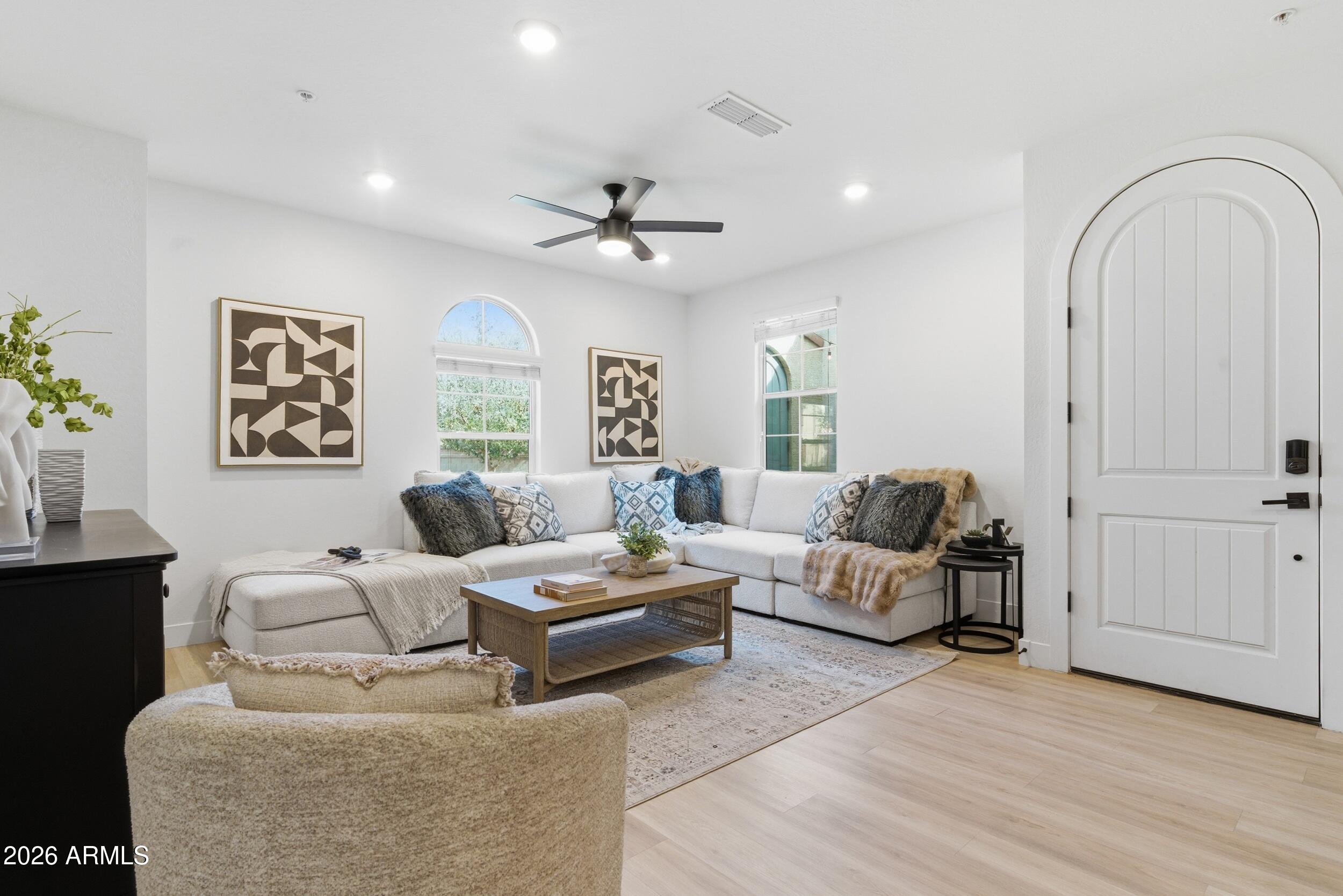 3855 South McQueen Road, Unit 34 Chandler, AZ 85286 - Photo 9 of 48 a living room with furniture and wooden floor