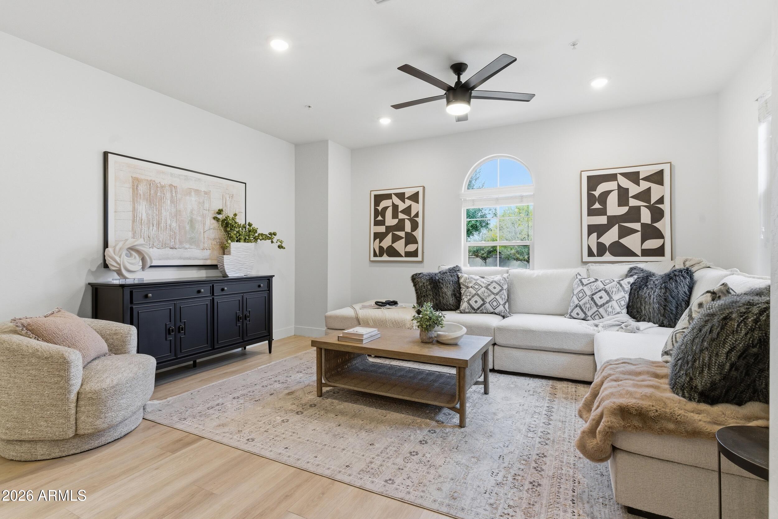 3855 South McQueen Road, Unit 34 Chandler, AZ 85286 - Photo 10 of 48 a living room with furniture and a ceiling fan