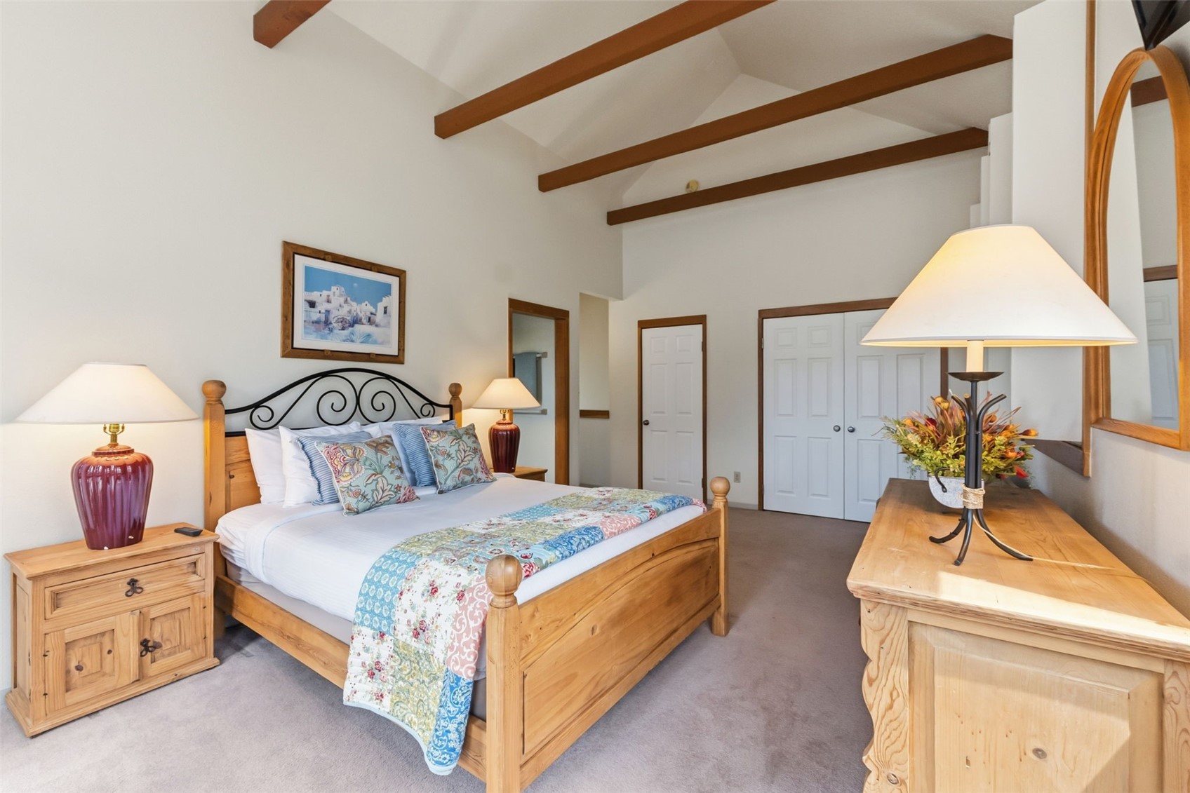 30 Tennis Club Road, Unit 1608 Keystone, CO 80435 - Photo 12 of 29 a bedroom with a bed and a chandelier
