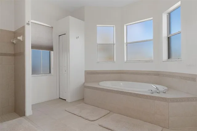 a bathroom with a granite countertop sink toilet and mirror