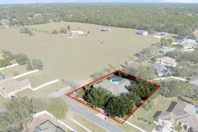 a view of a yard with chairs