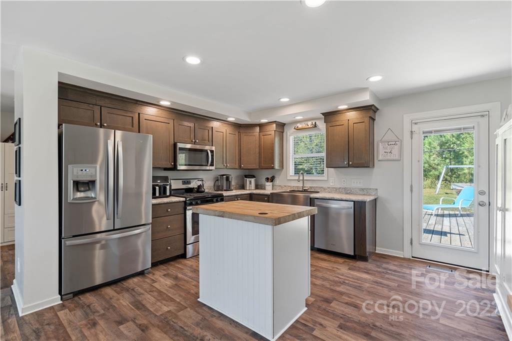 241 Plaxco Road York, SC 29745 - Photo 8 of 38 a kitchen with stainless steel appliances granite countertop a refrigerator stove microwave and sink