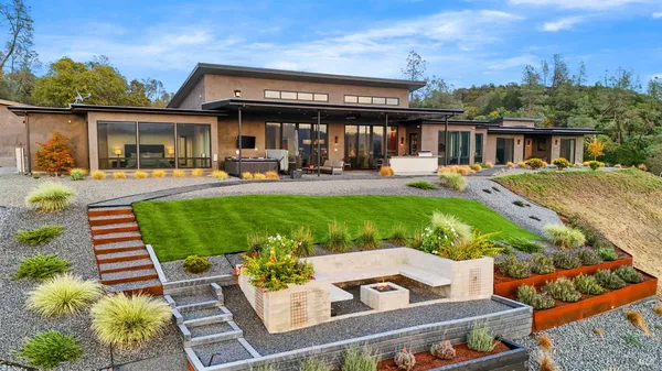 a view of a house with backyard porch and patio