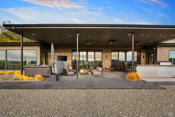 a view of a swimming pool with a patio and a couch