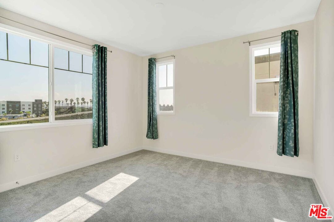 2850 Wagon Wheel Road, Unit 401 Oxnard, CA 93036 - Photo 17 of 31 an empty room with windows